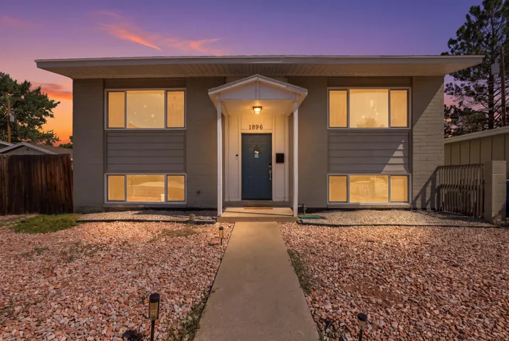 Contemporary exterior featuring horizontal siding and brick accents