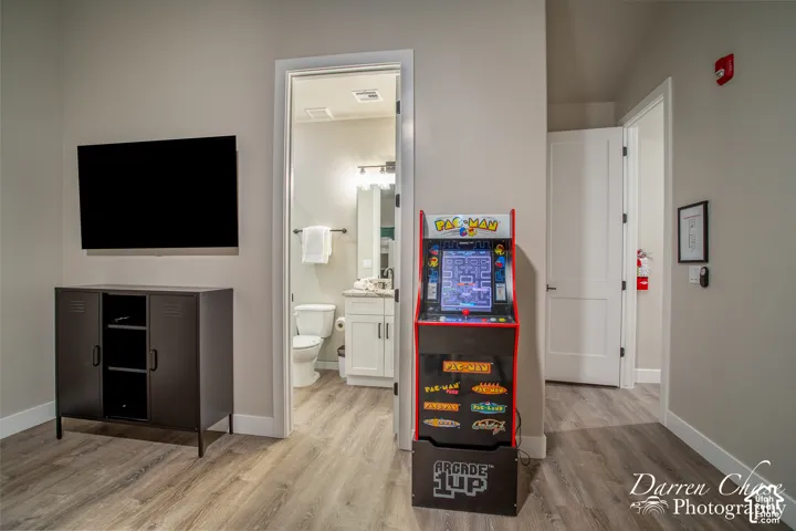 Wood-finish flooring, multi-panel doors, and neutral wall paint