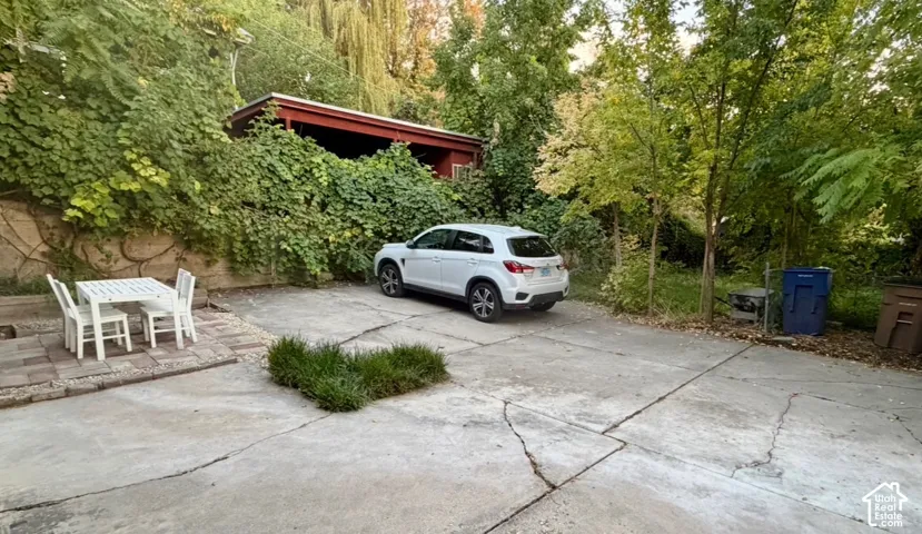 Concrete driveway with an integrated stone paver patio