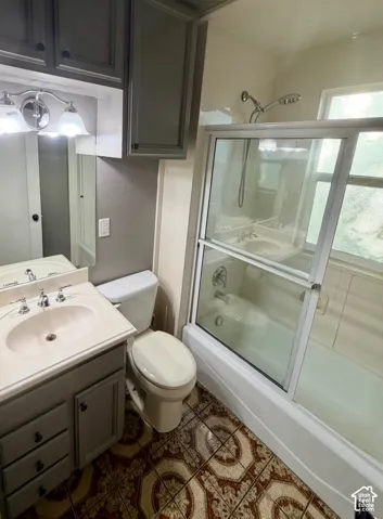 Spa-inspired bathroom featuring a ceramic pedestal sink with chrome fixtures, white subway tile surround, and a frameless glass-enclosed shower with dual showerheads