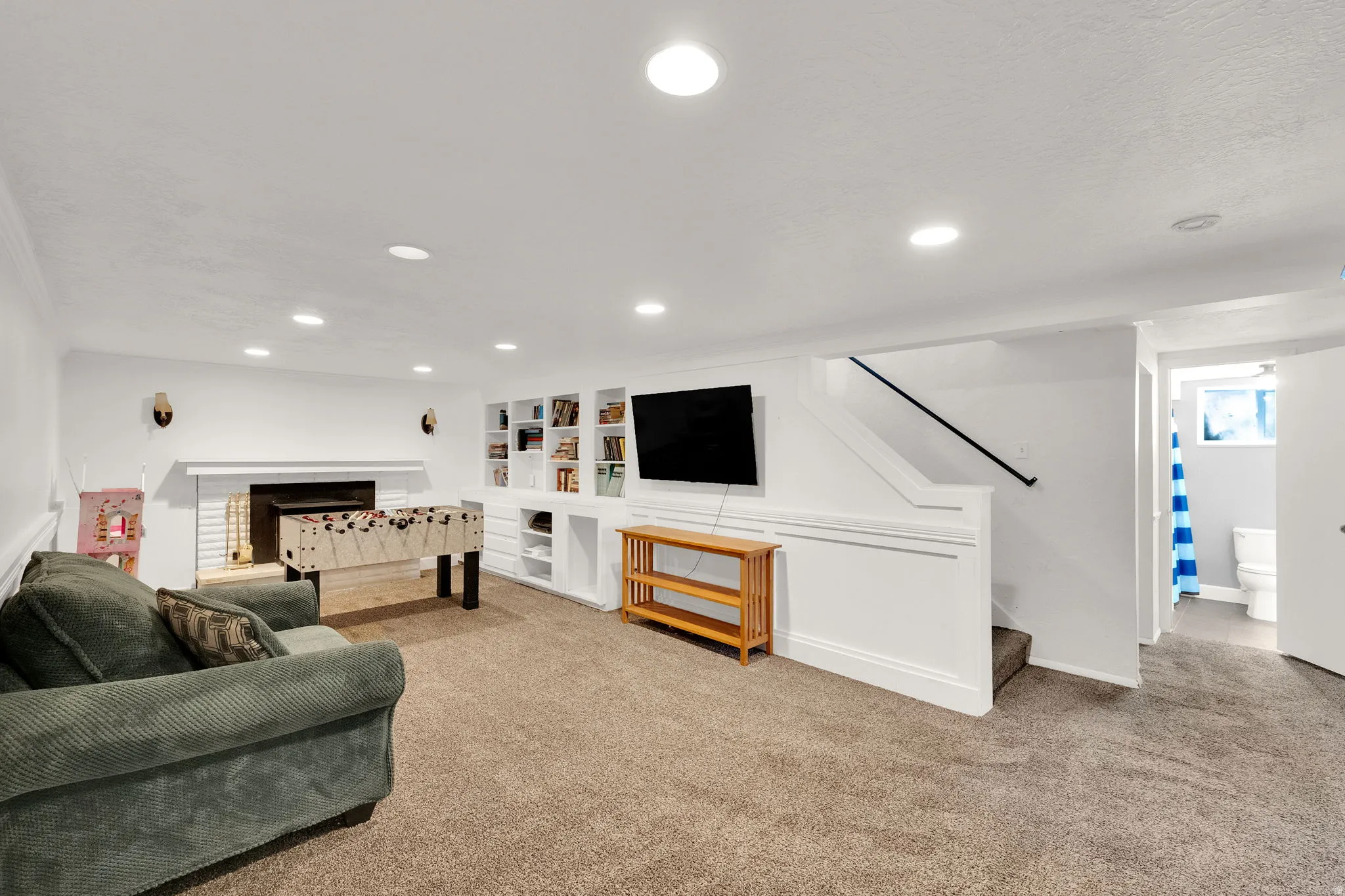 Recessed lighting and carpeted flooring