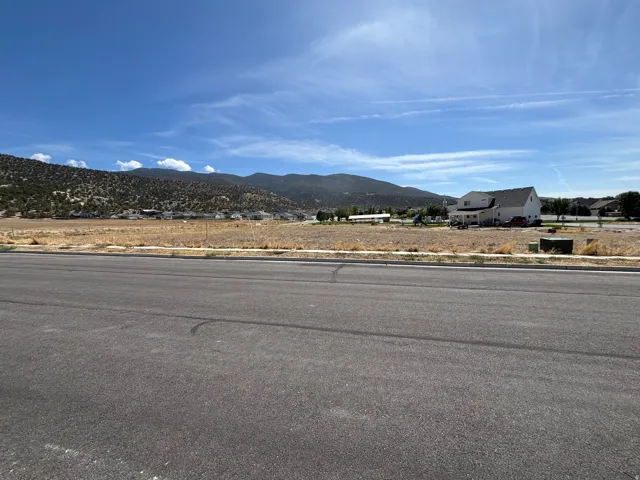 Paved street frontage with unpaved lot