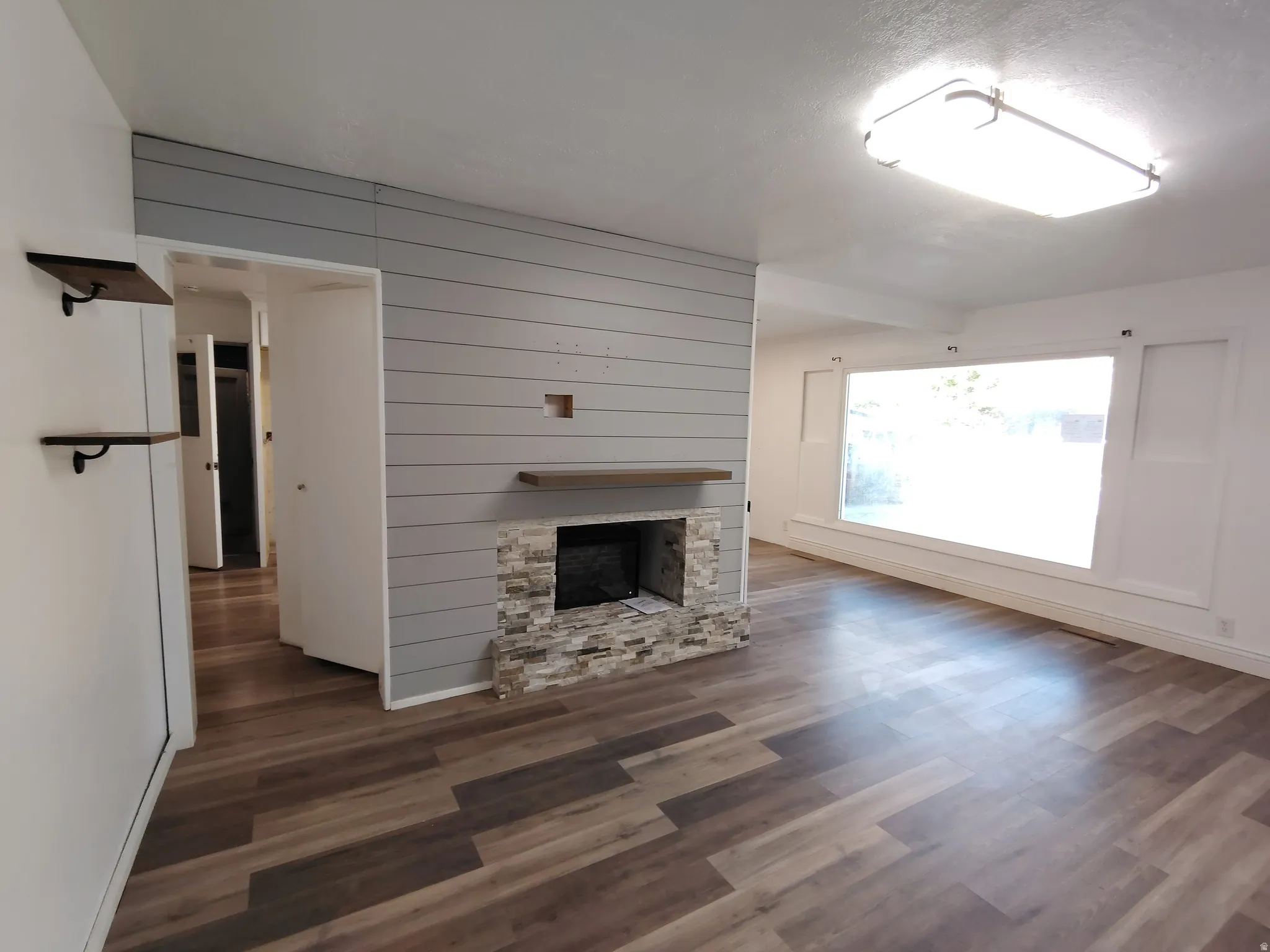 Wood-finish flooring throughout the space