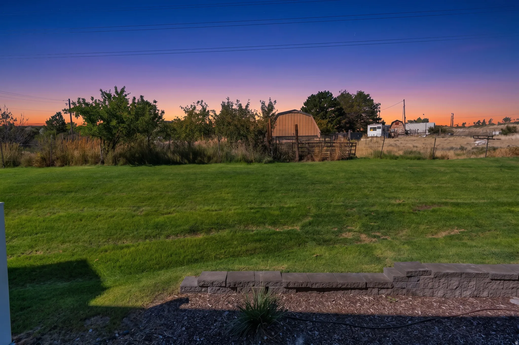 Expansive lawn area with a low retaining wall