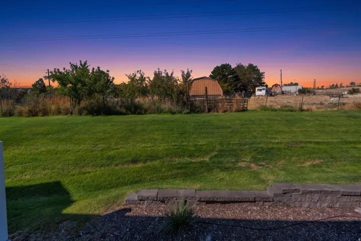 Expansive lawn area with a low retaining wall