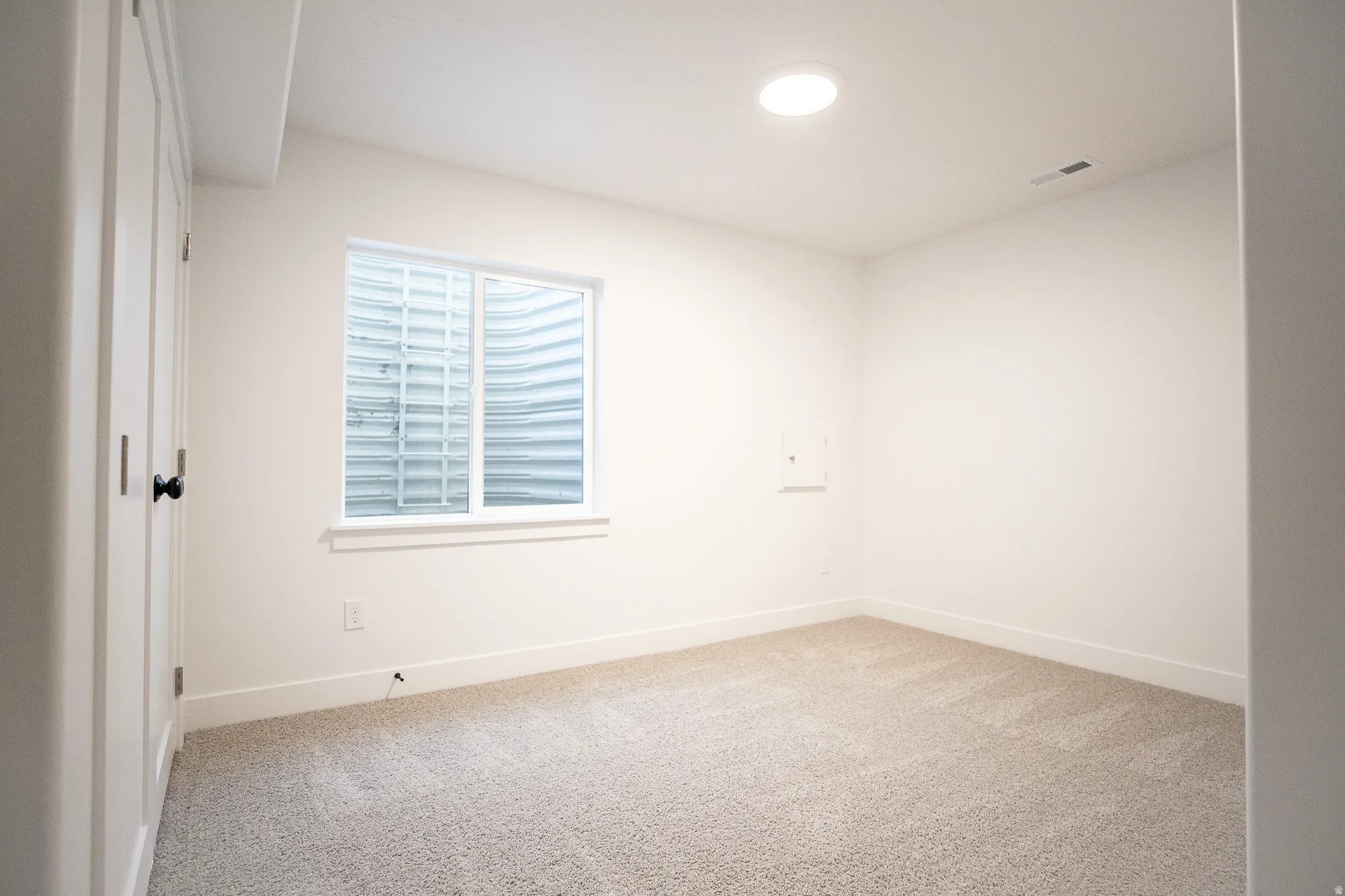 Bedroom #3 in full-finished basement with large closet.