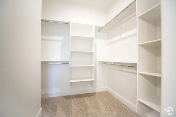 Large walk-in closet as part of primary suite.