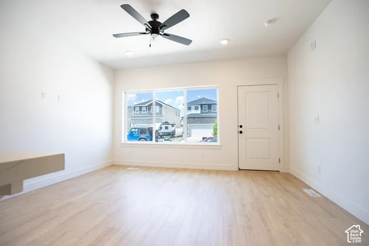 Family room with 9' ceiling and ceiling fan.