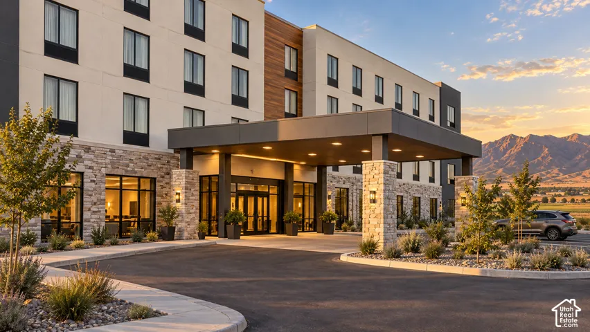Modern building exterior featuring stacked stone accents and a covered entrance