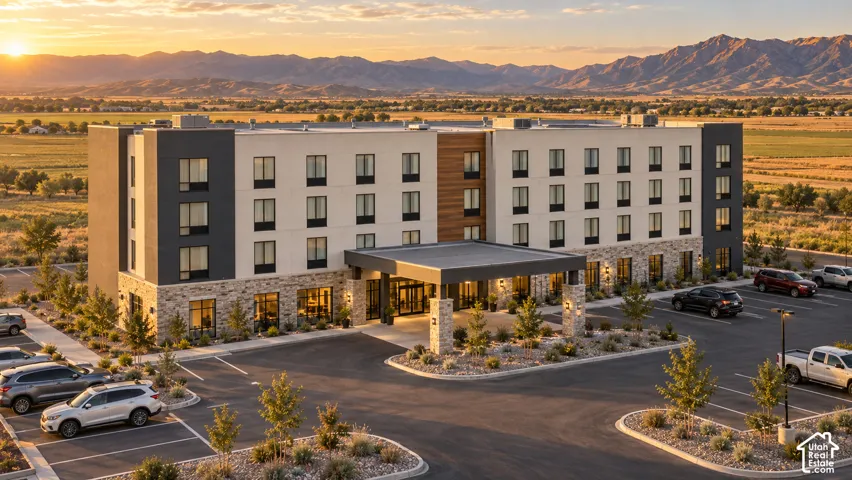 Multi-story building featuring a contemporary facade with stone accents and dark-framed windows