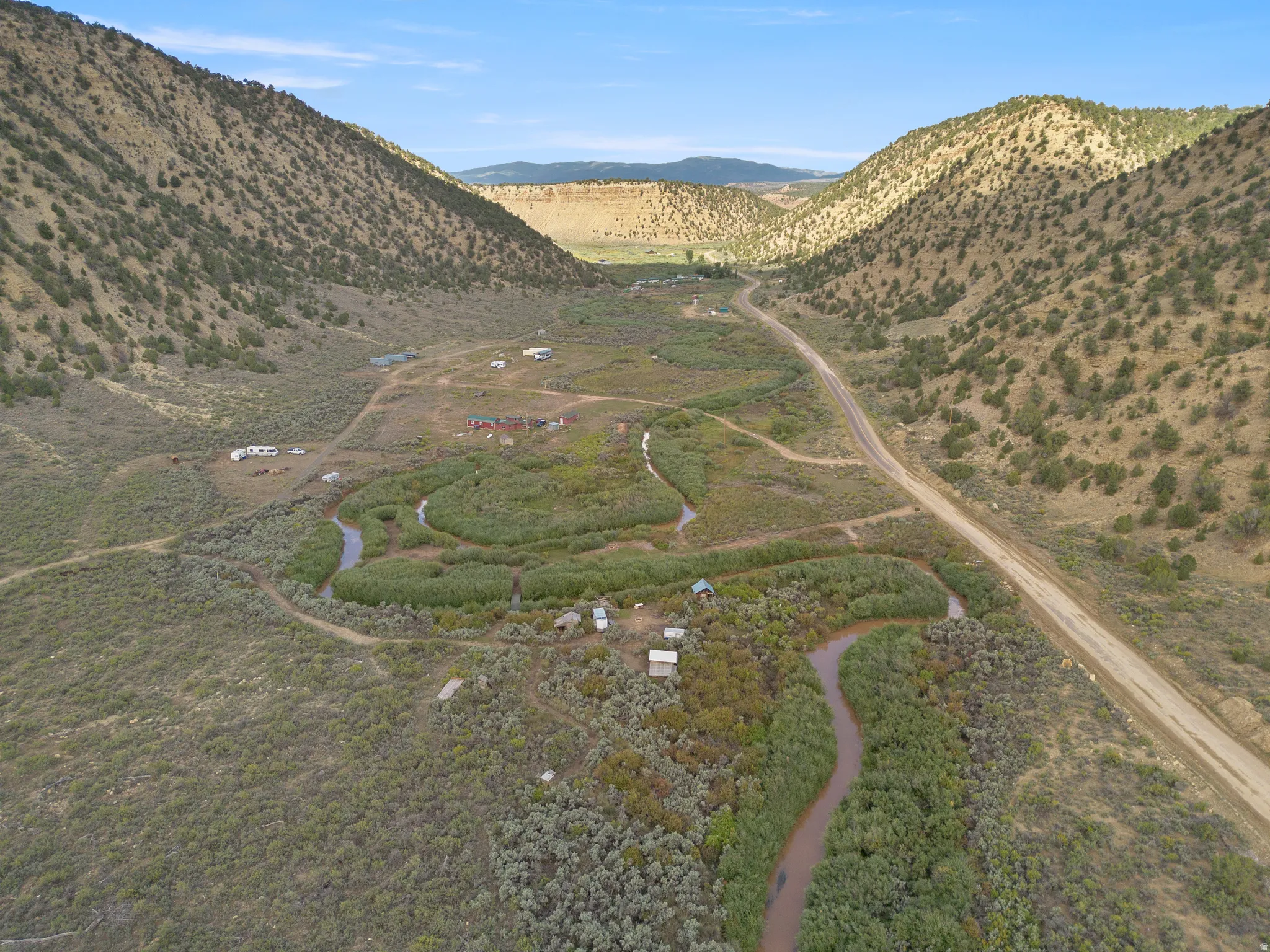 Arid valley terrain with a winding waterway