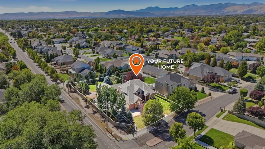 Spacious suburban lot with mature trees, surrounded by established residential properties and distant mountain ranges