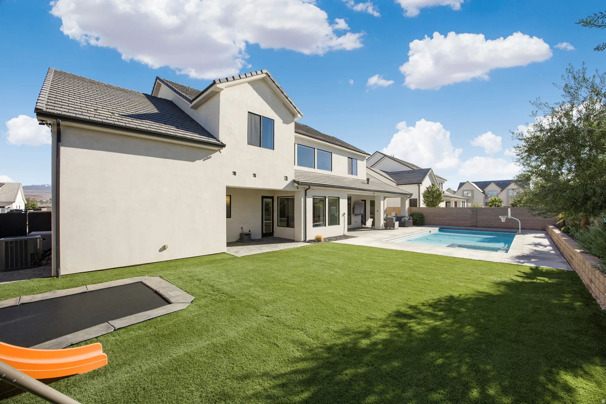 Stucco exterior with a pitched roof