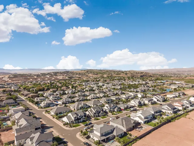 Residential neighborhood featuring a variety of single-family homes, paved streets, and mature landscaping