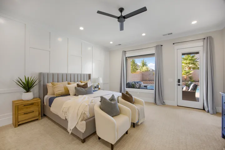 Recessed lighting, ceiling fan, direct patio access, outdoor pool, and board and batten wall detailing