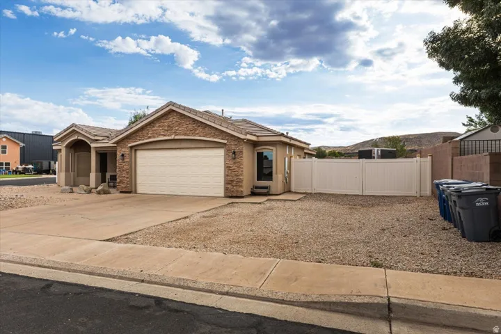 Stucco and stone facade with a two-car garage