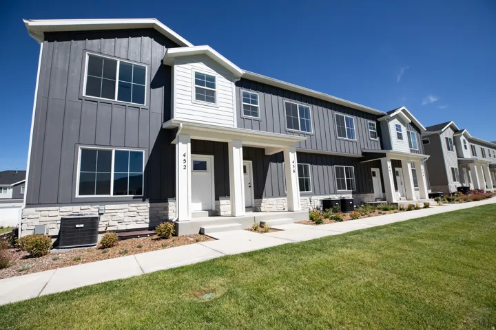 View of front elevation bordering a large park area