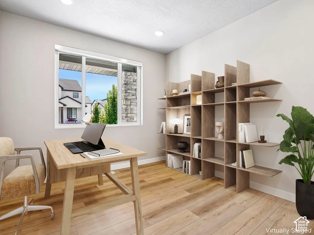 Recessed lighting, wood-finish flooring, and a window with blinds