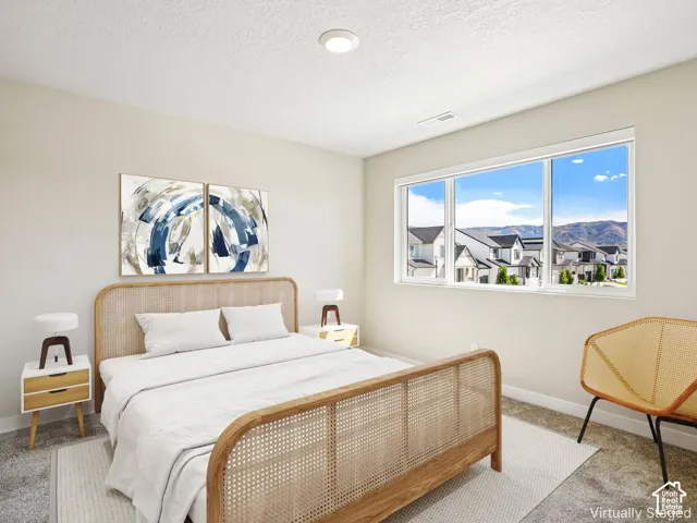 Expansive window offering a mountain backdrop and neighborhood scenery