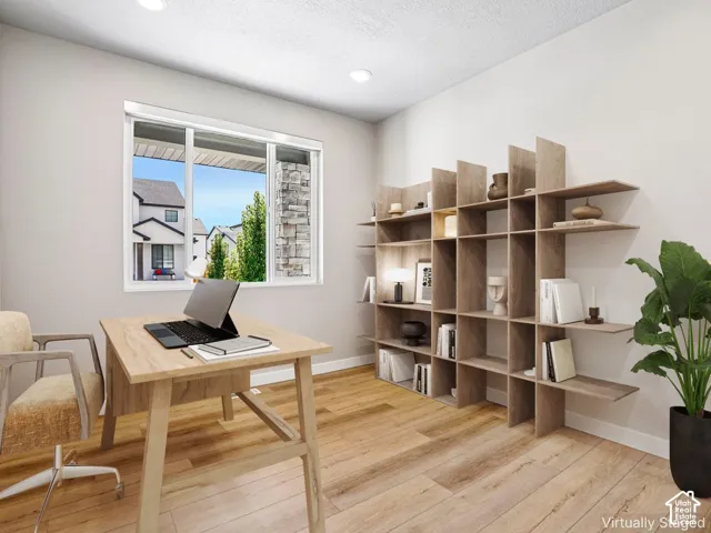 Recessed lighting, wood-finish flooring, and a window with blinds