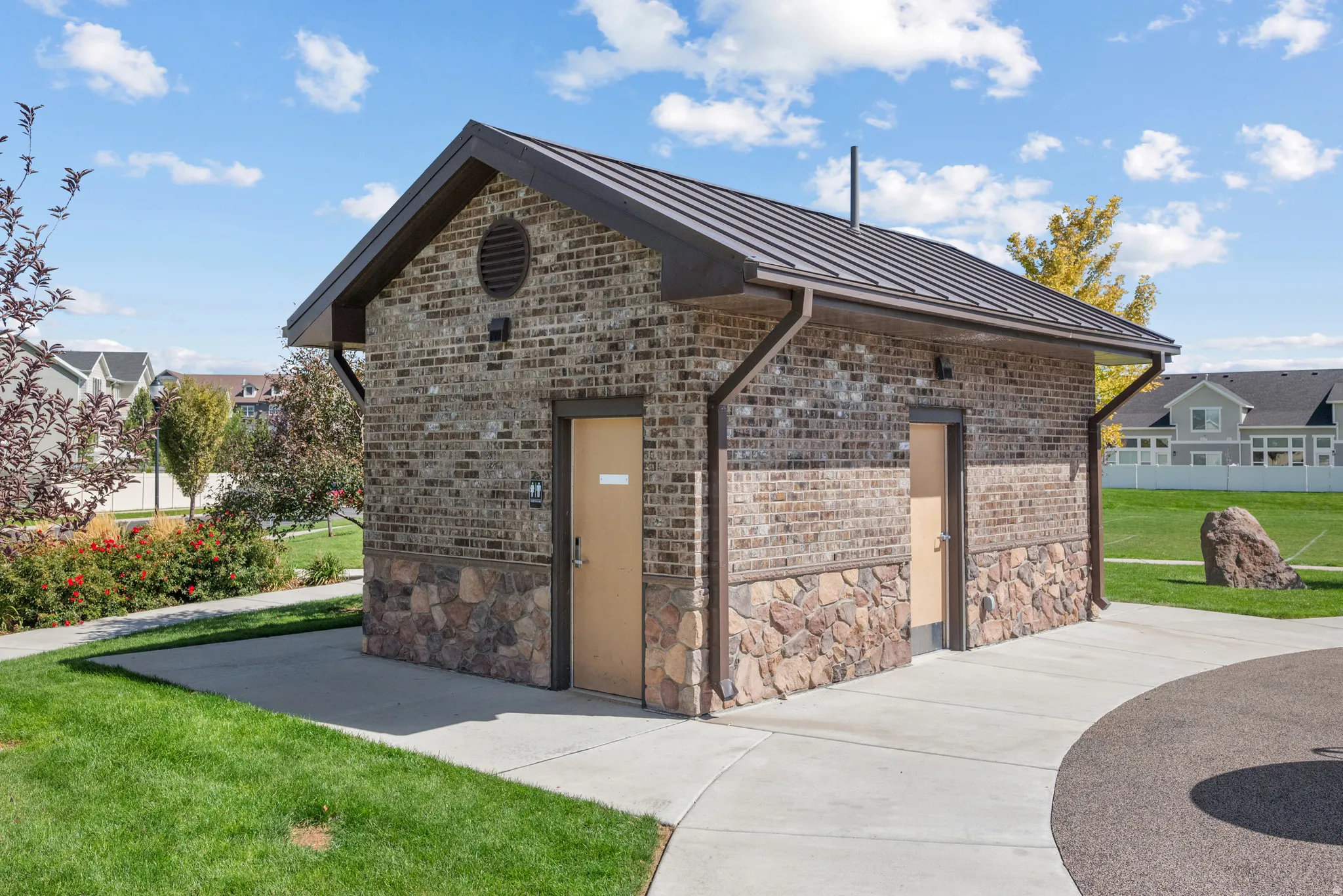 Brick and stone exterior with a metal roof