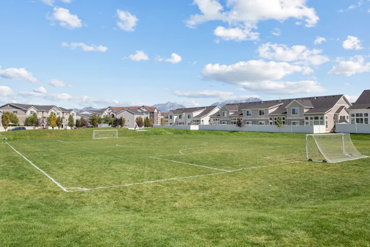 Expansive green field with marked boundaries and two goalposts