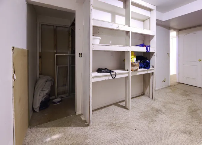Built-in shelving unit with multiple storage compartments