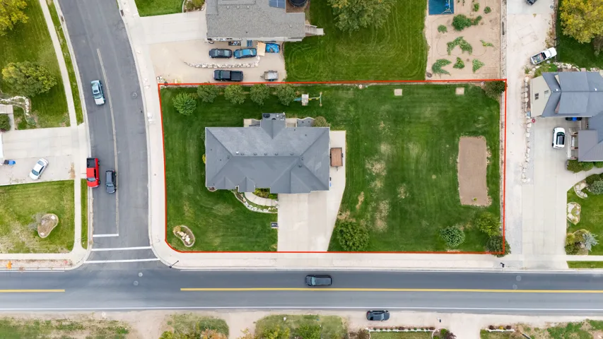 Expansive lot with a spacious lawn area and oversized side yard