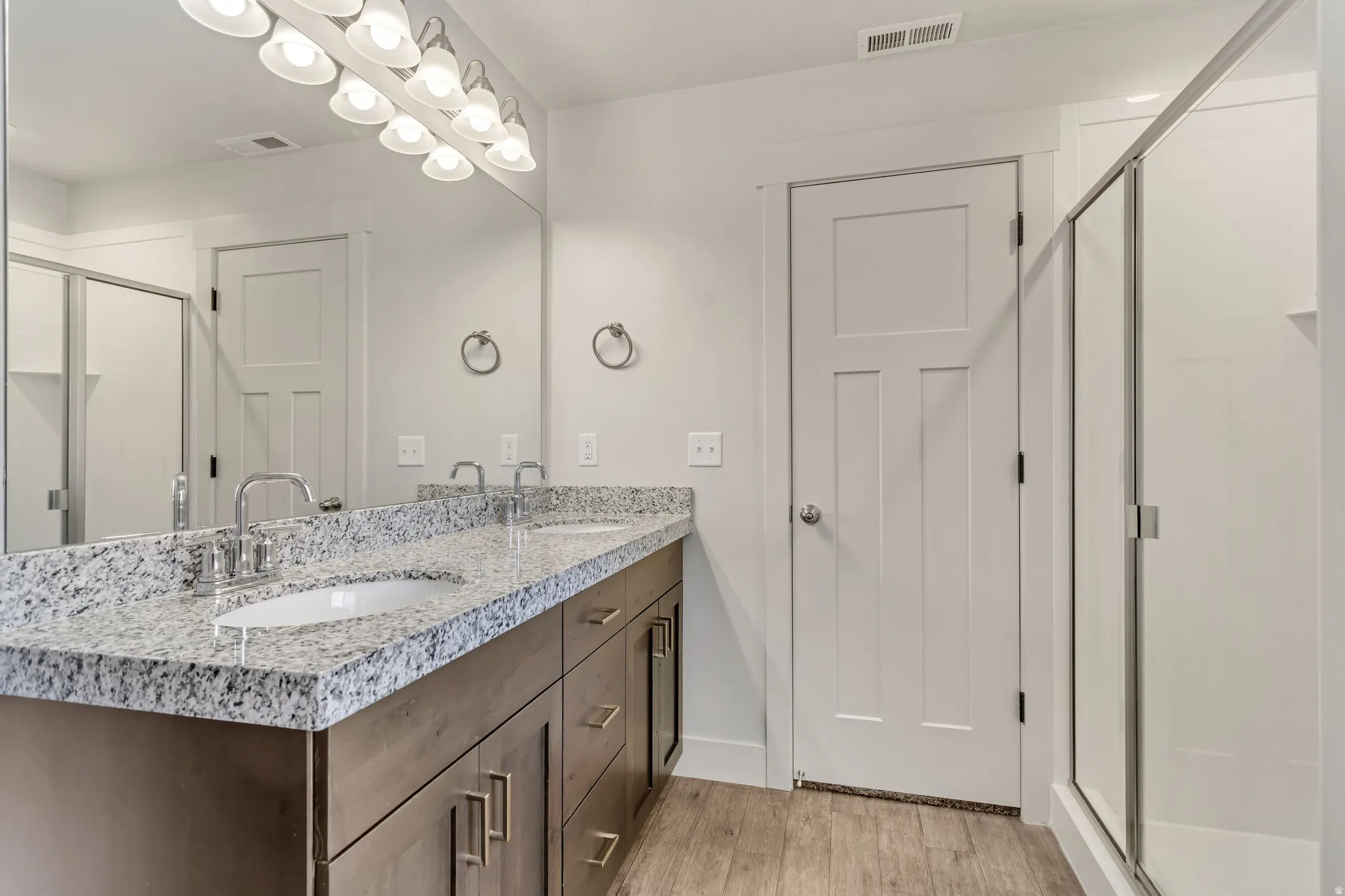 Dual vanity with stone countertop and undermount sinks