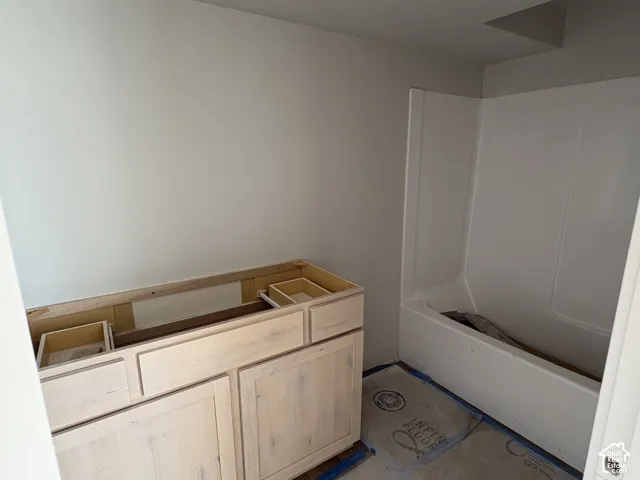 Unfinished natural wood-finish vanity with drawer and cabinet storage