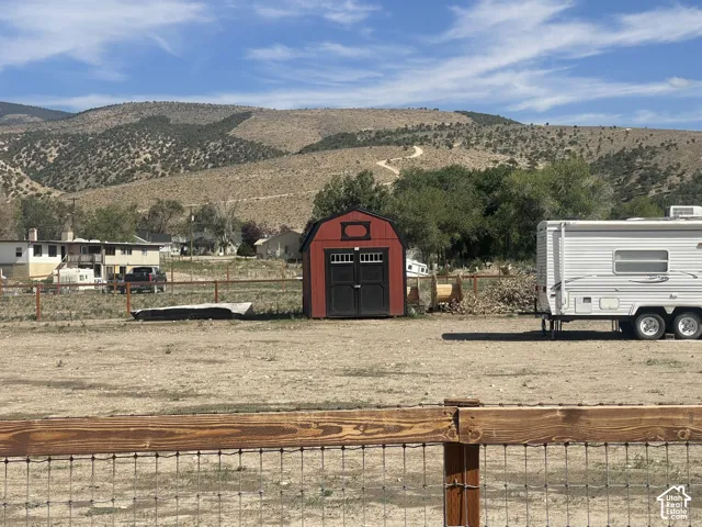 Red storage shed with double doors