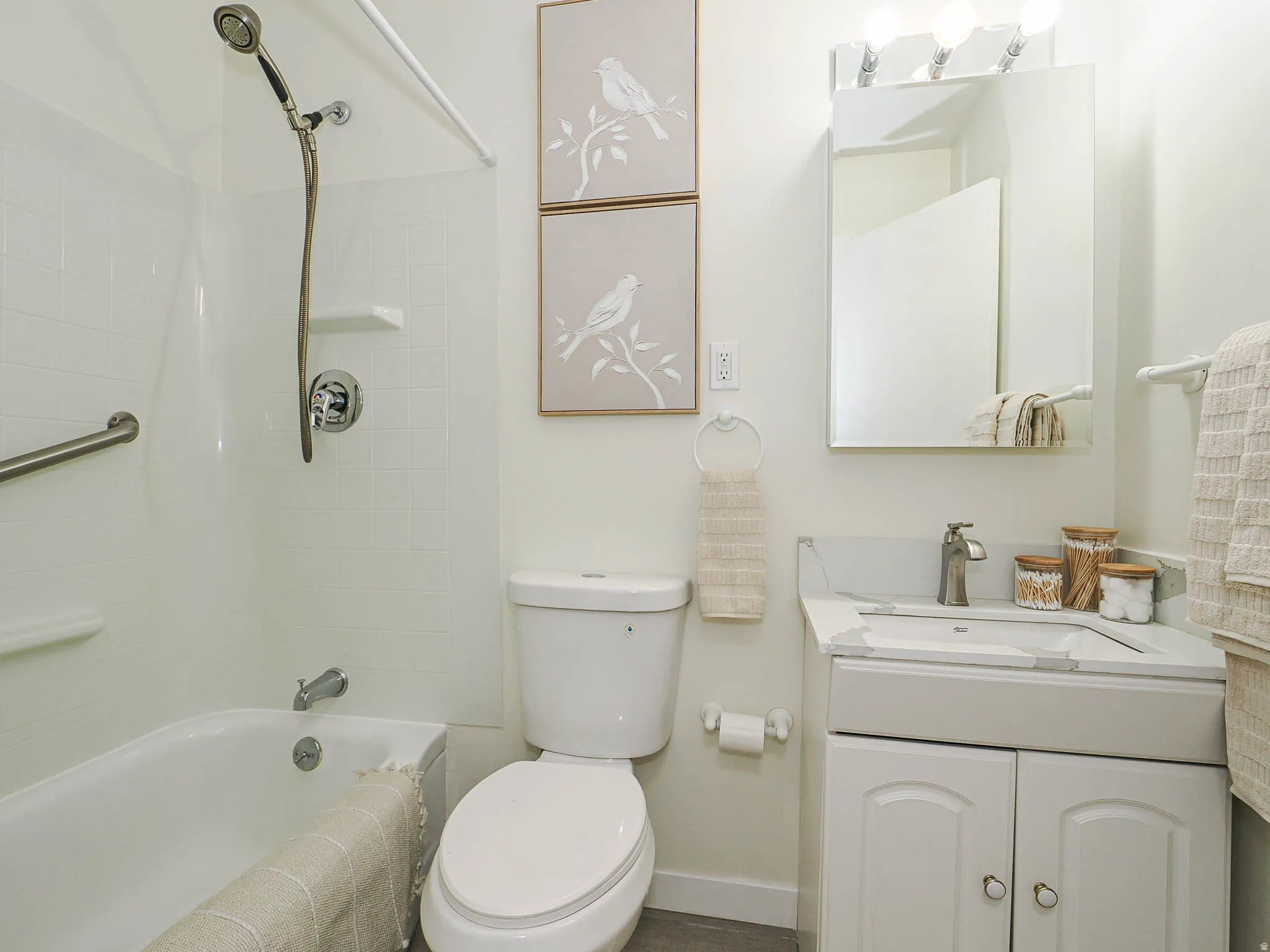 White tiled shower and tub combination