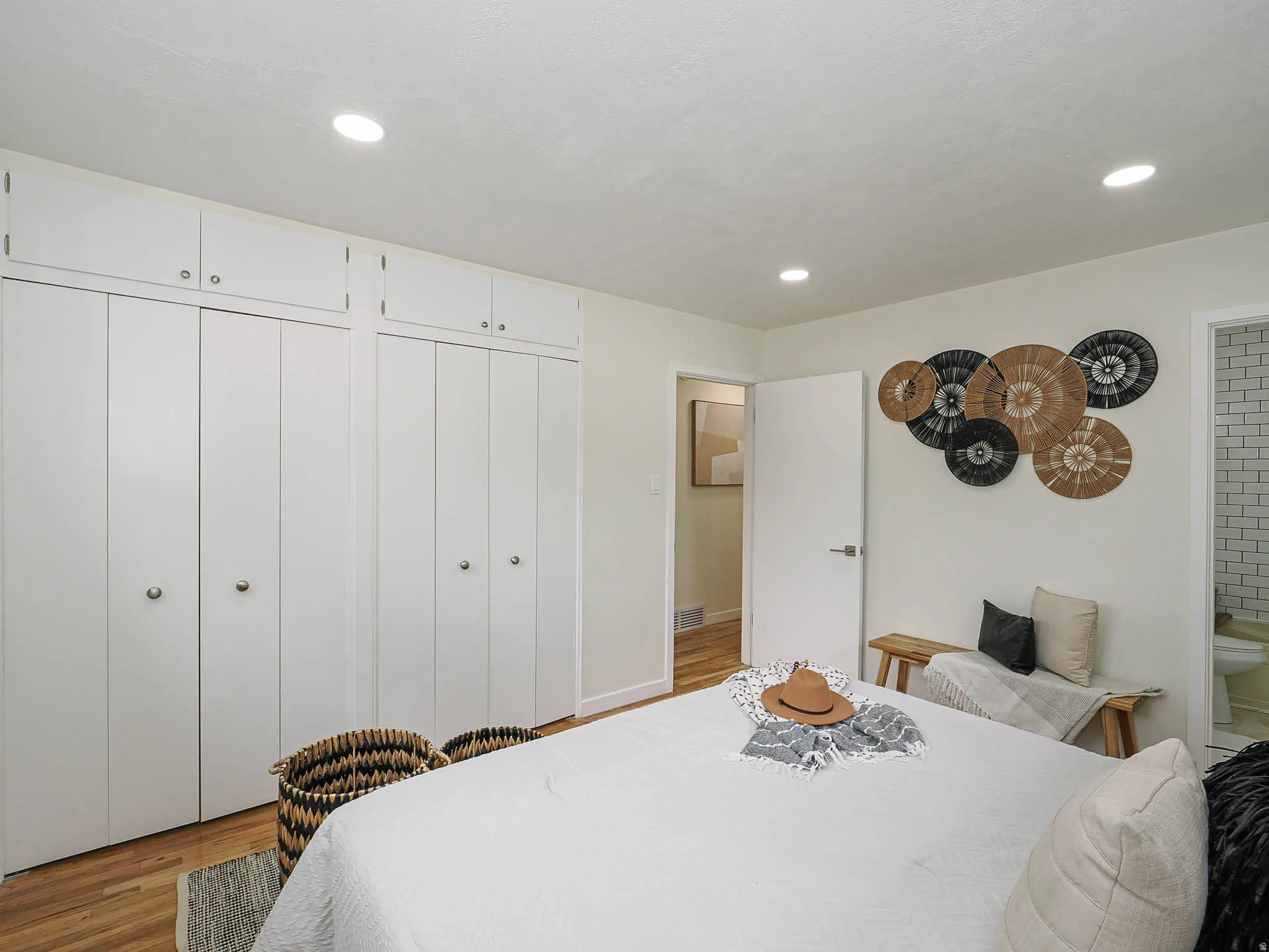 Built-in white cabinetry with overhead storage