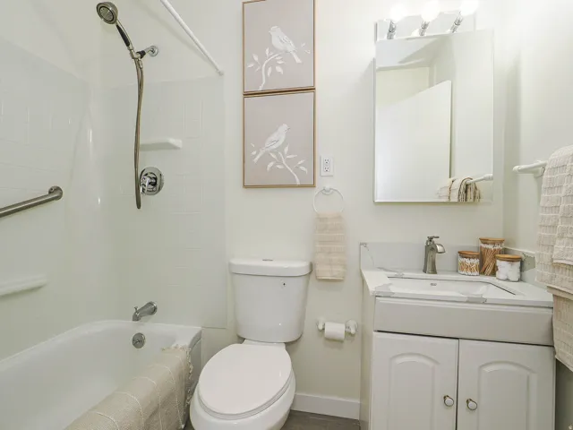 White tiled shower and tub combination