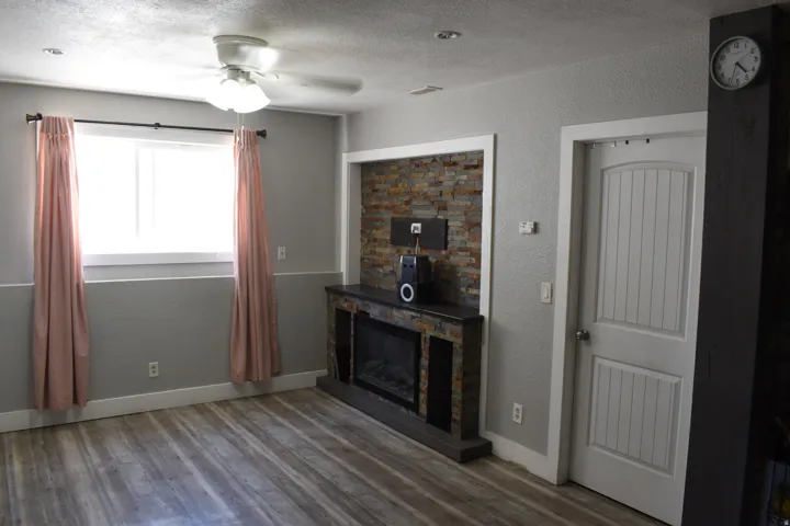 Wood-finish flooring, recessed lighting, and a ceiling fan