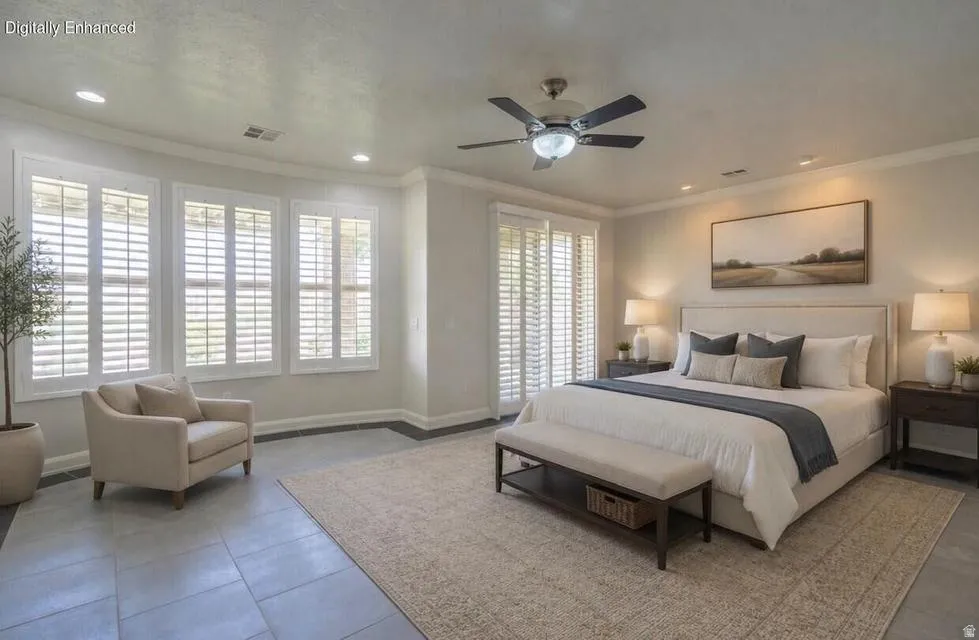 Recessed lighting and ceiling fan, multiple windows with plantation shutters, tile flooring, and neutral wall tones