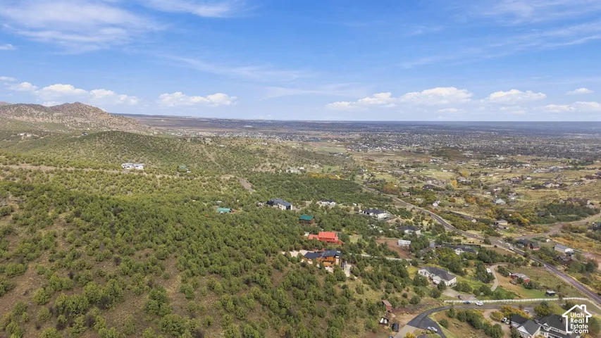 Elevated terrain featuring expansive mountainous topography and dense evergreen vegetation