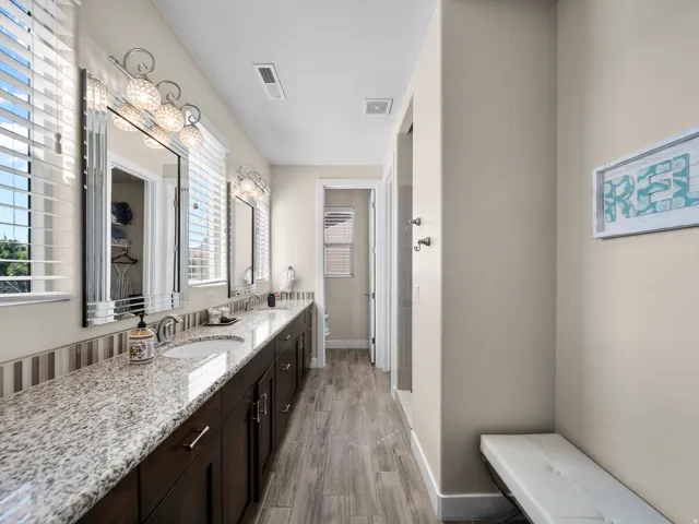 Extended dual vanity with stone countertop