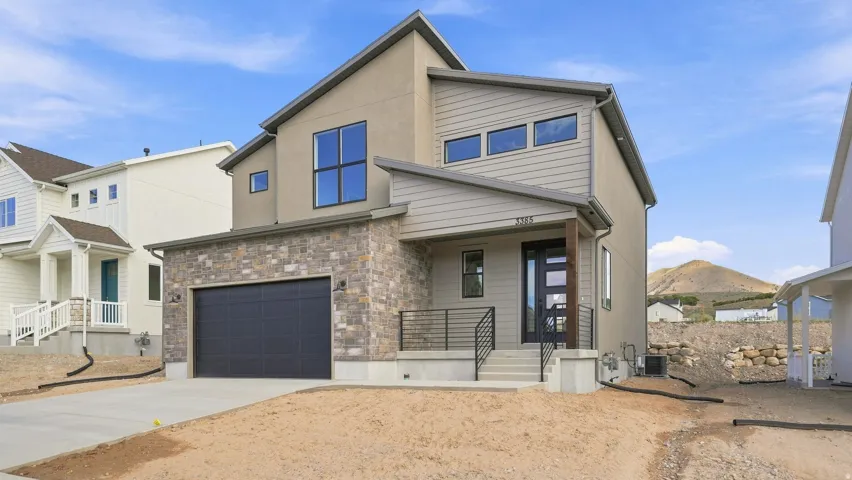 Contemporary exterior featuring stone accents and horizontal siding