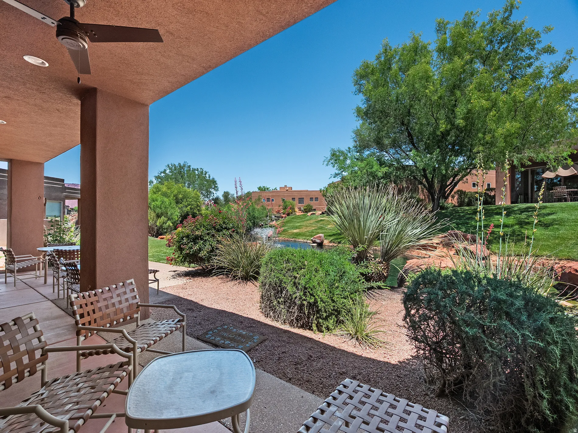 Covered patio with a ceiling fan, recessed lighting, and a paved surface