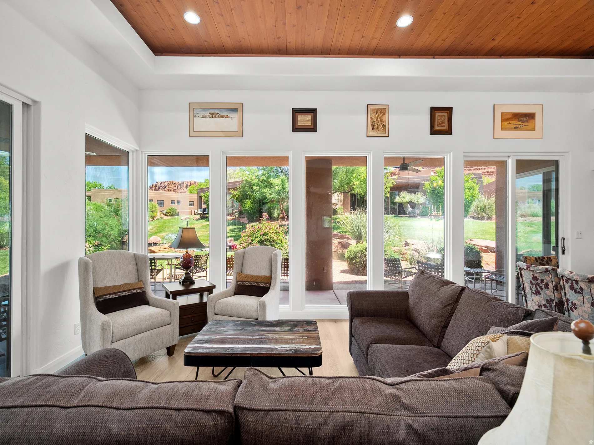 Tray ceiling with wood-finish paneling and recessed lighting