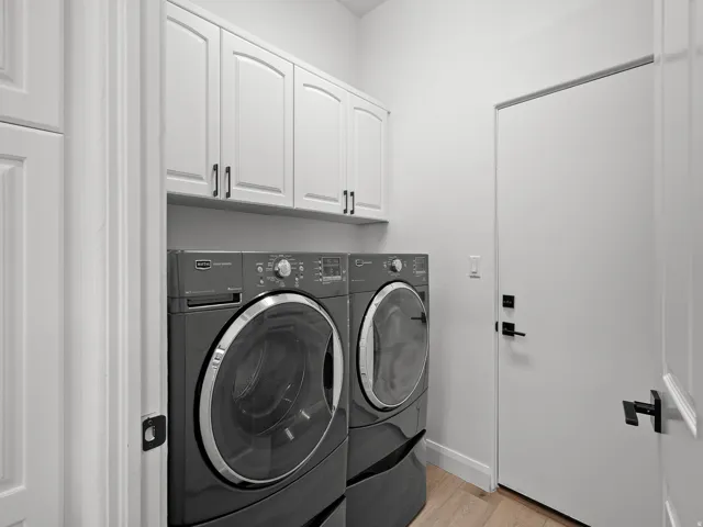 White shaker-style cabinetry with dark hardware