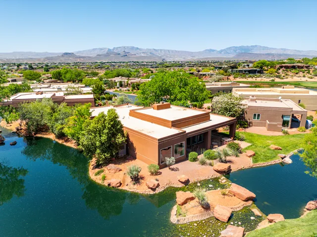 Southwestern-style residence featuring a flat roofline and integrated covered patio
