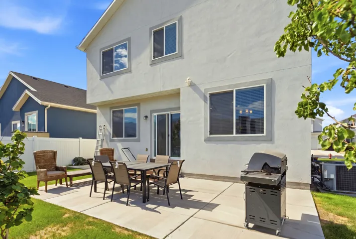 Expansive concrete patio with direct access to interior via sliding glass door