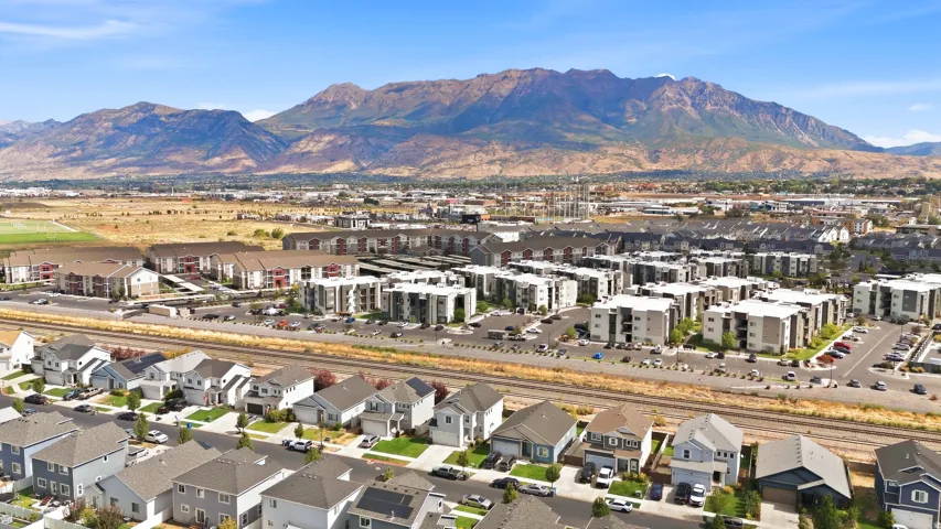 Residential community featuring a mix of single-family homes and multi-story apartment buildings