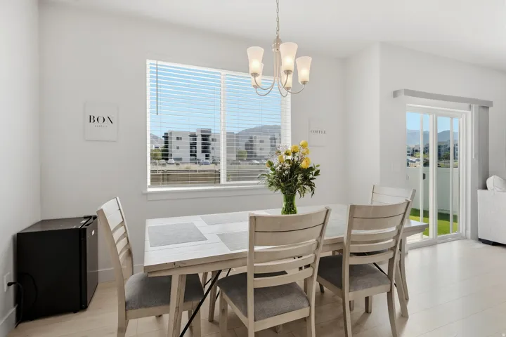 Recessed lighting, wood-finish flooring, and a chandelier fixture
