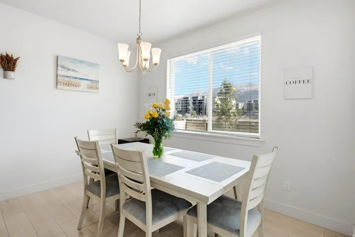 Wood-finish flooring with white baseboards