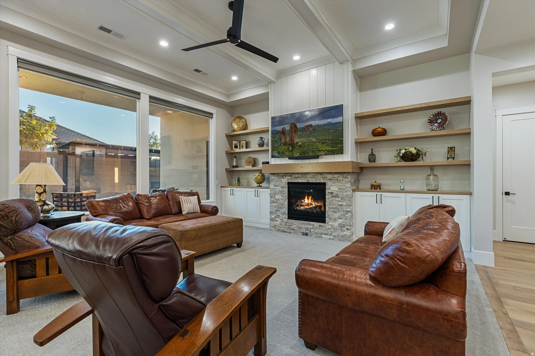 Large Living Area with Gas Fireplace & Automatic Lutron Blinds