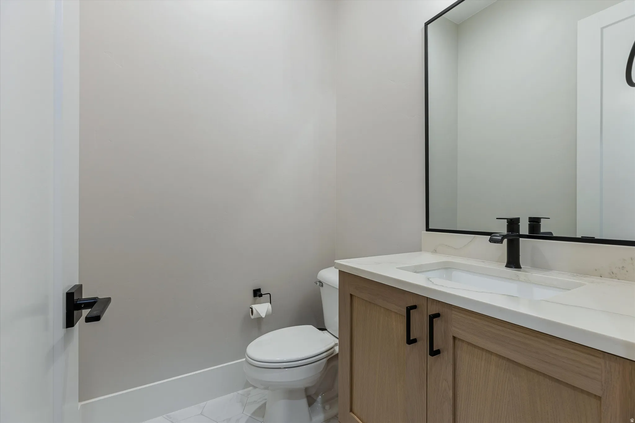 Half Bath by Kitchen & Garage