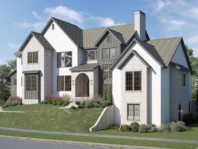 Multi-level residence featuring a pitched roof, stone and stucco exterior, and an arched entry